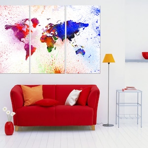 May include: A three-panel canvas print of a colorful world map with a splatter paint effect. The map is in shades of blue, red, green, and yellow. The background is white.