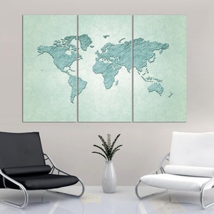 May include: A three-panel canvas print of a world map in a light blue color on a light green background. The map is drawn with a pencil-like texture. The canvas is hanging on a white wall above two black and white chairs.
