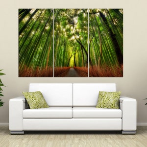 May include: A three-panel canvas print depicting a path through a lush green bamboo forest. The path is lined with tall bamboo stalks, and the sunlight filters through the leaves, creating a dappled effect.