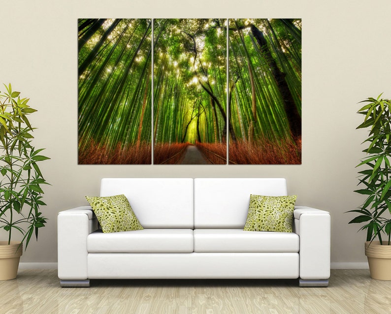 May include: A three-panel canvas print depicting a path through a lush green bamboo forest. The path is lined with tall bamboo stalks, and the sunlight filters through the leaves, creating a dappled effect.