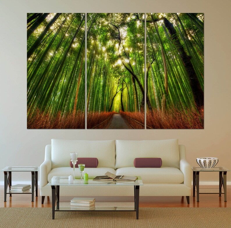 May include: A three-panel canvas print depicting a path through a lush green bamboo forest. The path is lined with tall bamboo stalks, and the sunlight filters through the leaves, creating a dappled effect.