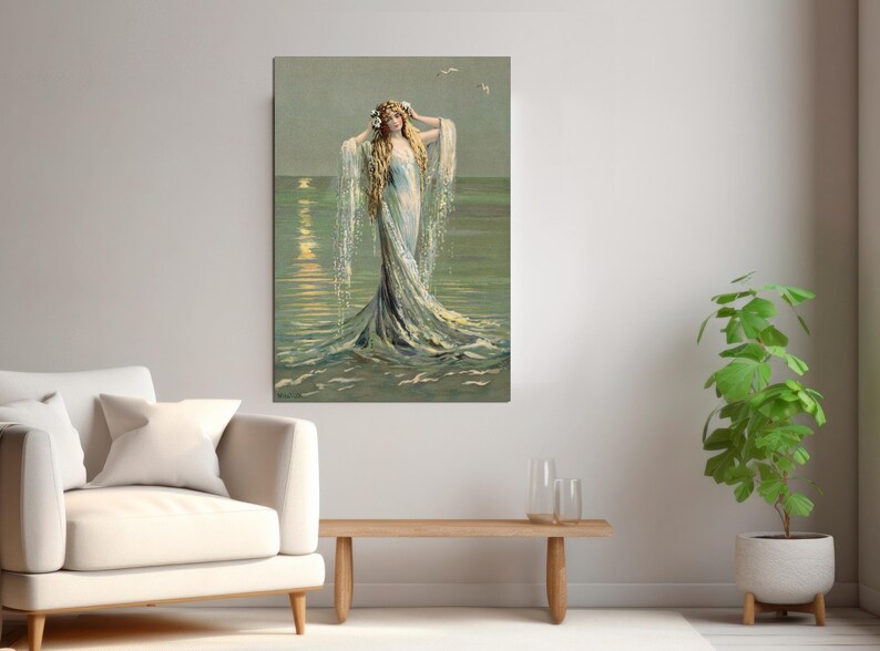 May include: A woman with long blonde hair wearing a flowing white dress stands in the ocean. The water is a light blue and green colour, and the sun is setting in the background.
