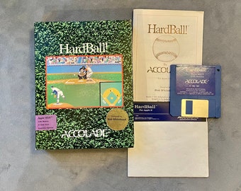 May include: A retro "HardBall!" computer game for Apple II, with a baseball scene on the box. Includes a blue 3.5" floppy disk, manual, and box with the Accolade logo. The box has a green grass-like pattern.