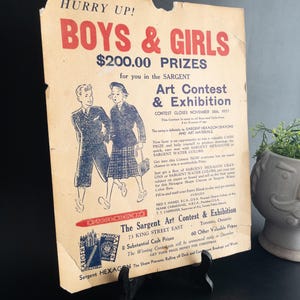 May include: Aged poster advertising the Sargent Art Contest & Exhibition, with illustrations of children. The text, in red and black, offers prizes and promotes Sargent crayons and watercolours. The contest closed November 30, 1937.