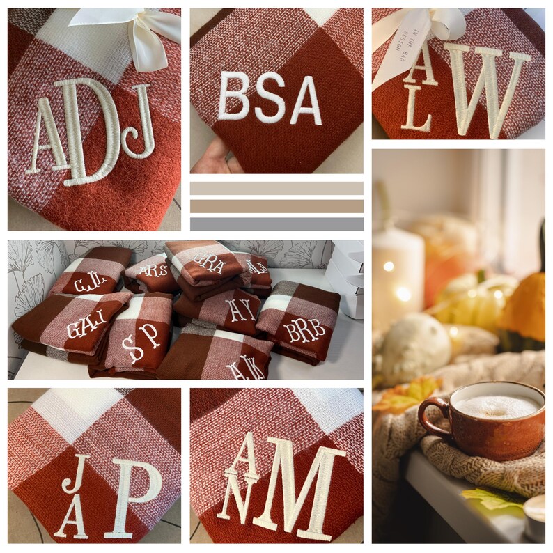 May include: A collection of personalized fleece blankets with various initials embroidered in white on a red and white plaid pattern. The blankets are folded and displayed on a table with a cup of coffee and fall decor in the background.