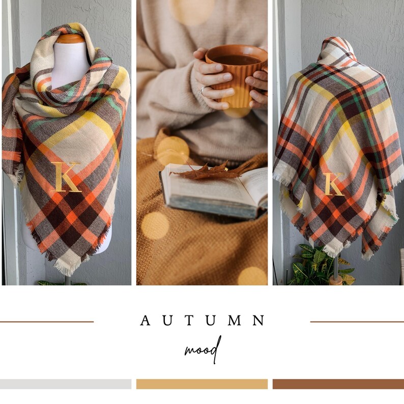May include: A plaid blanket scarf featuring a pattern of cream, brown, orange, and yellow stripes with a gold embroidered letter K on the front. The scarf has a frayed edge finish and is displayed on a mannequin in a triangular folded style.
