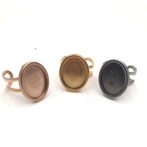 May include: Three adjustable rings with oval-shaped bezels. The rings are made of metal and come in gold, rose gold, and silver.