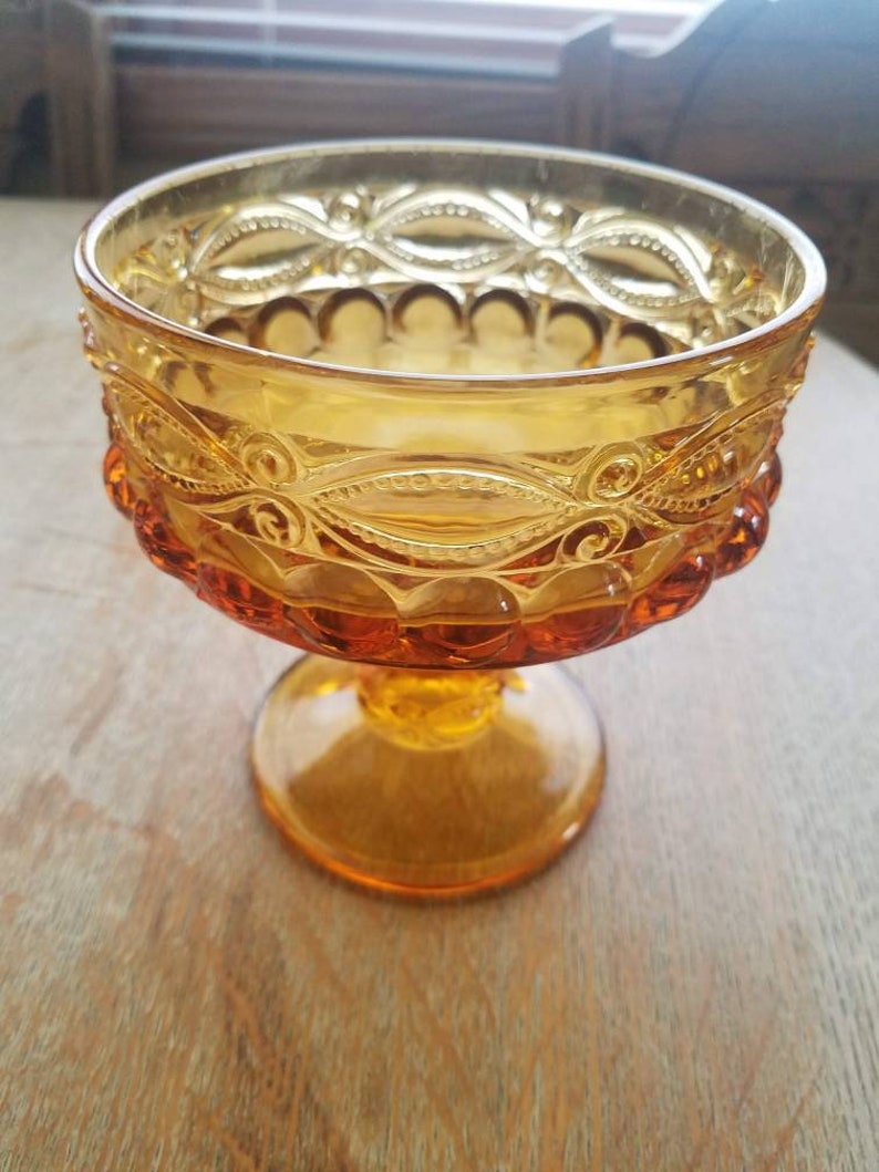 Amber glass pedestal dish candle holder or table centerpiece