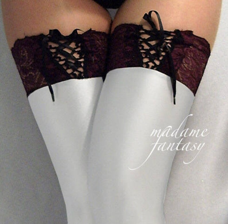 White shiny spandex stockings burgundy lace up top