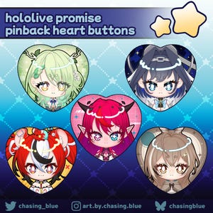May include: Heart-shaped pinback buttons featuring anime-style character illustrations. The buttons showcase characters with various hair colors and designs. The text "hololive promise pinback heart buttons" is at the top. The background is blue with star patterns.