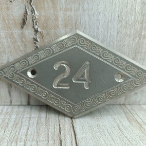 House Number 24 Sign On Door Photos and Images