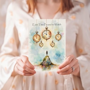 May include: A greeting card featuring a watercolor illustration with the text "Even Time Paused to Watch." The artwork depicts a figure on a hill beneath hanging pocket watches. The color palette includes blues, greens, and browns.