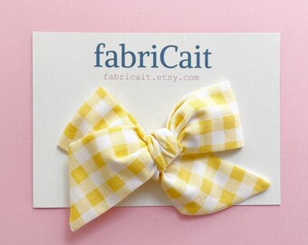 Yellow Check Hair Bow. Yellow Gingham Bow. Yellow Hair Accessories. Yellow Gingham Hair Bow. Yellow Summer Bow. Yellow Knotted Hair Bow.