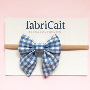 Blue Gingham Baby Bow. Dorothy Baby Bow. Gingham Baby Headband. Blue Gingham Baby Bow. Gingham Bow Headband. Blue Gingham. Blue Check Bow.