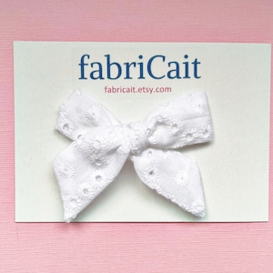 White Eyelet Baby Bow: Newborn Hair Clip or Headband