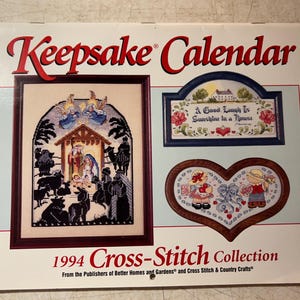 May include: A 1994 Keepsake Calendar featuring a cross-stitch collection. The calendar includes framed cross-stitch designs with religious and heartwarming themes. The text "A Good Laugh Is Sunshine in a House" is visible.