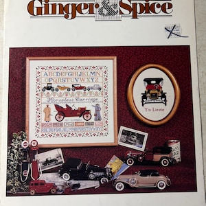 May include: A cross-stitch pattern booklet featuring a vintage car design. The cover features a red and white car with the text "Horseless Carriage" and "Tin Lizzie". The booklet includes a chart for cross-stitching the alphabet and a vintage car.
