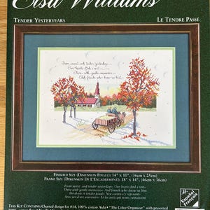 May include: Cross stitch pattern for a counted cross stitch project titled "Tender Yesteryears" by Elsa Williams. The pattern features a charming autumn scene with a church, trees, and a wagon. The finished size is 14 inches by 10 inches, and the frame size is 18 inches by 14 inches.