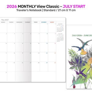May include: A white Traveler's Notebook with a monthly calendar layout, starting July 2026. The cover features a hummingbird design with the text "2026 Monthly View Classic - July Start". The notebook is 8.25 inches by 4.33 inches.