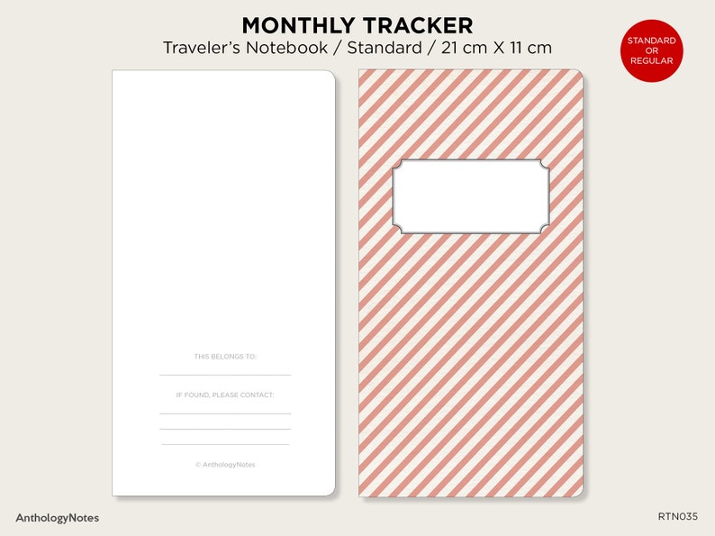 May include: A pink and white striped notebook cover with a blank label. The cover is for a standard size traveler's notebook, measuring 21 cm by 11 cm. The text "MONTHLY TRACKER" is printed at the top of the cover.