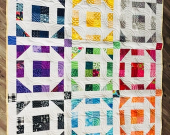 Colorful churn dash baby/lap quilt