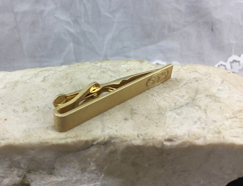 Vintage Midcentury Mens Designer Gold Tone Tie Bar Clasp by Swank Textured Patina with Engraved Detail