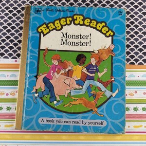 May include: Vintage children's book titled "Eager Reader Monster! Monster!" with a blue cover. The cover features illustrations of children, a pig, a dog, a cow, and a chicken. The book is a "Little Golden Book."