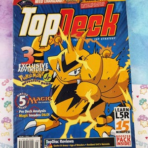 May include: A vintage Top Deck magazine featuring a yellow and black Pokemon character on a blue background. The magazine cover includes text such as "Exclusive Adventures" and "Booster Pack Inside!"