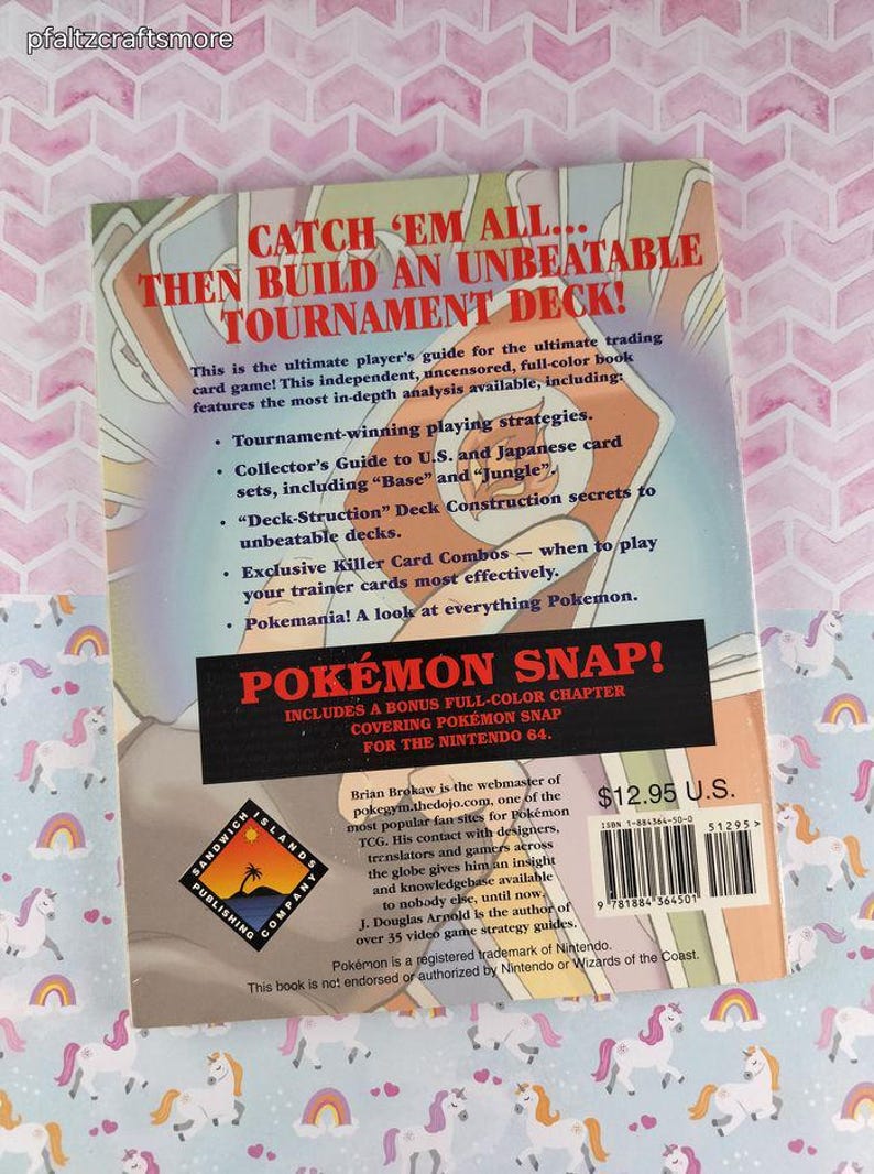 May include: A paperback book titled "Catch 'Em All... Then Build an Unbeatable Tournament Deck!" with a bonus chapter on Pok&eacute;mon Snap for the Nintendo 64. The book includes tournament strategies and collector's guides.