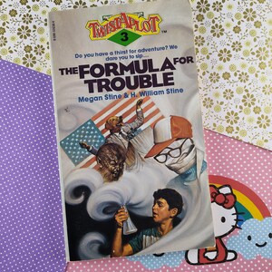 May include: A book cover for "The Formula for Trouble", the third book in the "Twistaplot" series. The cover features a young boy, a werewolf, and a dog wearing a red, white, and blue hat. The book is written by Megan Stine and H. William Stine.