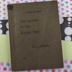 May include: A brown book titled "The Quaker of the Future Time" by George Albertson. The book was published in 1916 and is part of the William Penn Lectures series.