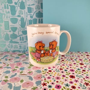 May include: White ceramic mug with a brown bear illustration. The mug has a handle and says "You're bear-y special to me".