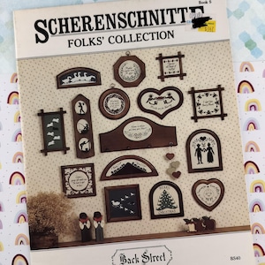 May include: A book titled "SCHERENSCHNITT FOLKS' COLLECTION" showcasing framed silhouette designs. The designs include landscapes, figures, and festive themes. The cover has a price tag and the text "Back Street".