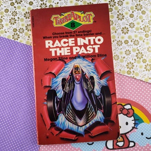 May include: A red and black book titled "Twistaplot 8: Race Into The Past" by Megan Stine and H. William Stine. The cover features a futuristic car speeding through a time warp.