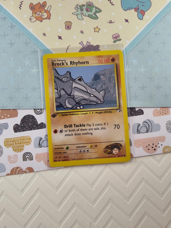 rhyhorn pokemon card Jungle MP, 61/64 Flip a coin The Rhyhorn Pokemon card |