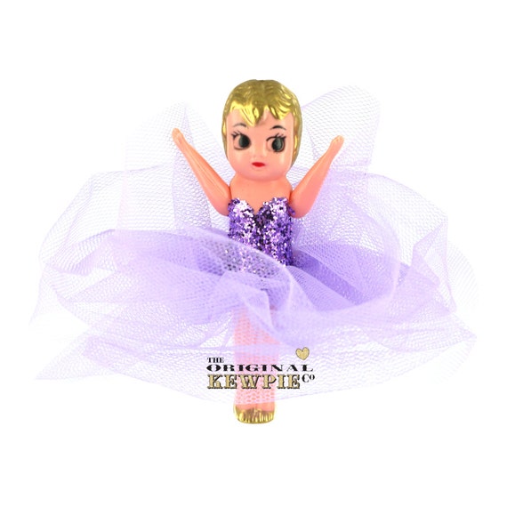 kewpie doll on stick