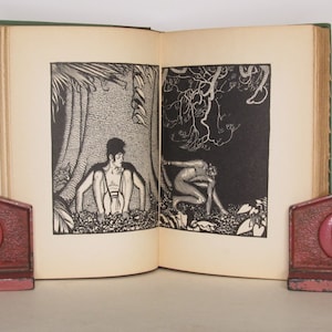 May include: An open book with black and white illustrations. The book is bound in green cloth with gold lettering. The illustrations depict a man sitting under a tree and a creature crouching in the shadows.