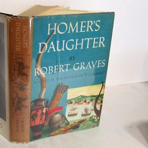 May include: A book cover with a blue background and the title "Homer's Daughter" by Robert Graves. The cover features a drawing of a bow and arrow, a vase, a helmet, and a scene of ships sailing in a harbor.