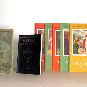 May include: A collection of vintage Catholic books and prayer books, including a Catholic Child's Missal and Prayerbook, a Catholic School Speller, and a Catholic Know-Your-Bible Program book titled "The Early Miracles of Jesus".