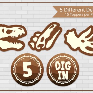 May include: Five printable dinosaur party cupcake toppers with brown and white designs. The toppers feature dinosaur skeletons, a number 5, and the text "DIG IN".
