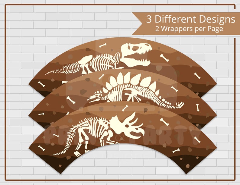 May include: Three cupcake wrappers with dinosaur skeleton designs. The wrappers are brown with a textured background and white dinosaur skeletons. The text "3 Different Designs 2 Wrappers per Page" is at the top of the image.