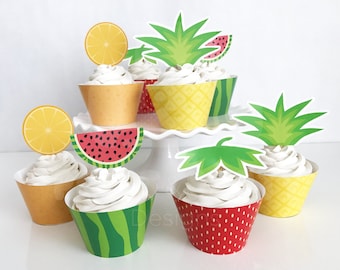 May include: Cupcakes with white frosting in colorful fruit-themed wrappers. The wrappers feature designs of watermelon, pineapple, orange slices, and strawberries. Green and yellow toppers complete the festive look.