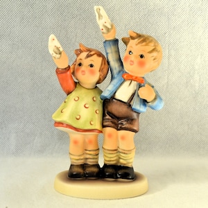 - Etsy Hummel Waving