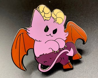 May include: A pink and purple demon cat with gold horns and orange wings. The cat is sitting on its hind legs with its tail curled around its body.