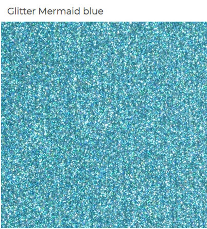 May include: A close-up of blue glitter with a fine texture. The glitter is a light blue color with a slight iridescent sheen.