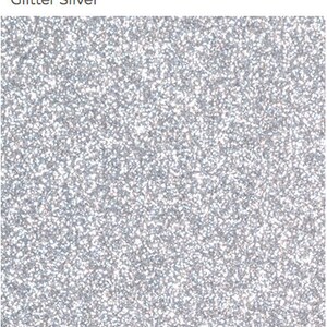 May include: Silver glitter background with a fine, sparkly texture.