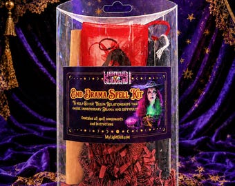 May include: A clear plastic cylindrical container holding an End Drama Spell Kit. The label features the text End Drama Spell Kit, Lightclub Curiosity, and MyLightClub.com, with an illustration of a person in a hat. Inside are red and black items.