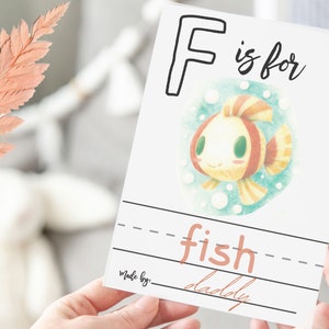 example page letter f with a drawing of a fish signed by daddy