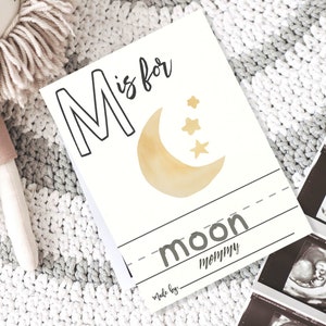 Blank coloring page letter M with example of a moon drawing set next to a stuffed lion and a set of ultrasound pics.