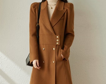 May include: A brown double-breasted wool coat with gold buttons and a long, A-line silhouette.